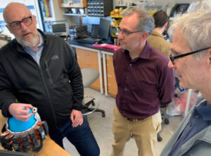 Scientists standing in lab